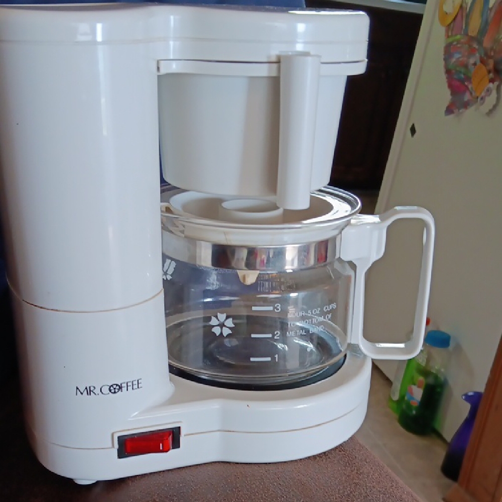 Sleek White Coffee Maker with Glass Carafe and Modern Design